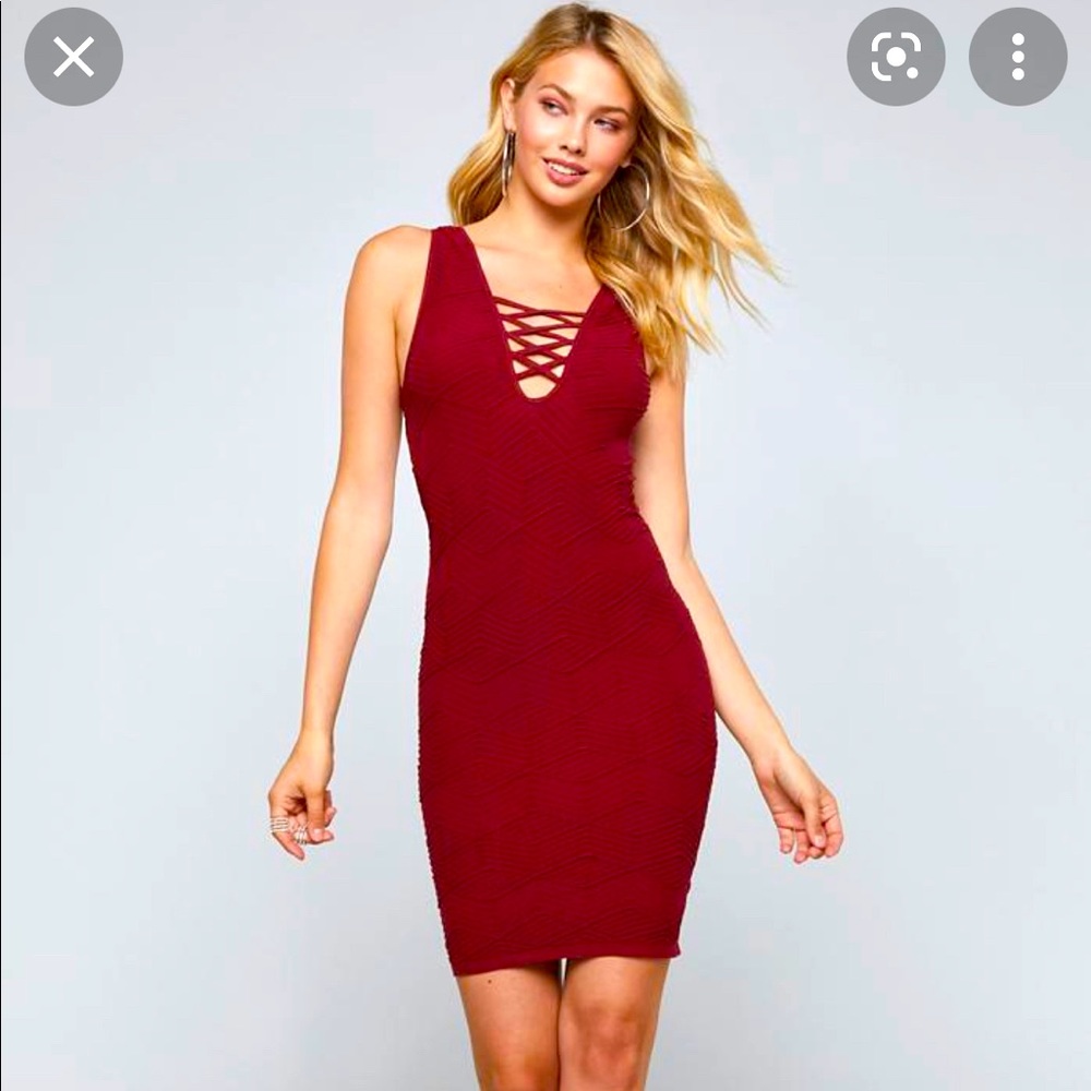 Red body con dress from BeBe size Medium. Brand new!